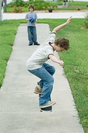 Boy jumping with skateboard Stock Photo - Premium Royalty-Free, Code: 695-05763510