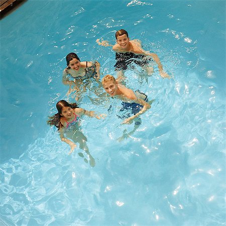 simsearch:400-05381058,k - Children in swimming pool, elevated view Stock Photo - Premium Royalty-Free, Code: 695-05774089