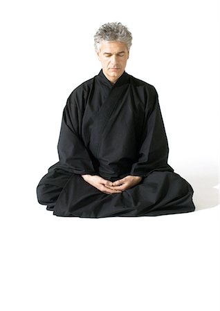 peace silhouette in black - Man sitting on floor, meditating Stock Photo - Premium Royalty-Free, Code: 695-05774925