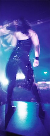 Person dancing in nightclub, rear view Stock Photo - Premium Royalty-Free, Code: 695-05775202