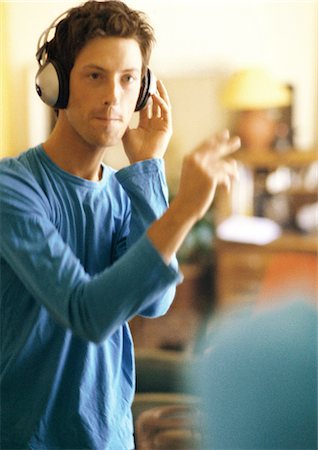 Man wearing headphones Stock Photo - Premium Royalty-Free, Code: 695-05776164