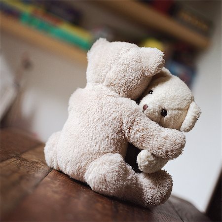 Teddy bears hugging on table Stock Photo - Premium Royalty-Free, Code: 695-05776567