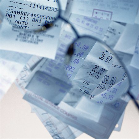 simsearch:693-06021323,k - Sales receipts viewed through glasses Stock Photo - Premium Royalty-Free, Code: 695-05776577