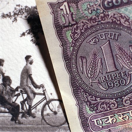 rupee - Paper bill next to old photograph Stock Photo - Premium Royalty-Free, Code: 695-05776587