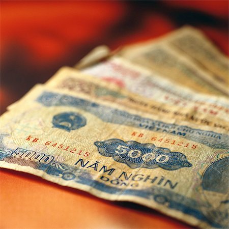 Vietnamese paper money on table Stock Photo - Premium Royalty-Free, Code: 695-05776610