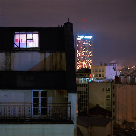 Exterior view of attic apartment illuminated at night Stock Photo - Premium Royalty-Free, Code: 695-05777093