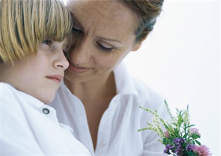 Mother and son with bouquet of wildflowers Stock Photo - Premium Royalty-Free, Code: 695-05777403