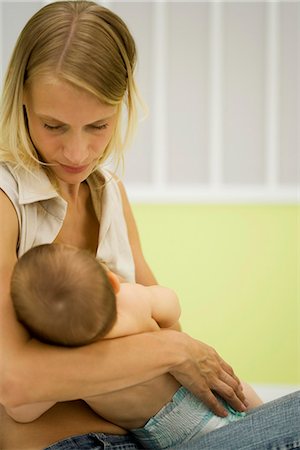 Young mother nursing baby Stock Photo - Premium Royalty-Free, Code: 695-05779794