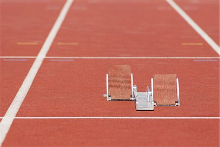 Starting blocks on running track Stock Photo - Premium Royalty-Free, Code: 695-05770086