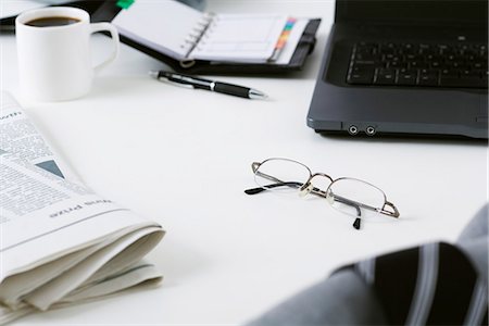 selective focus computer no people - Glasses left on messy desk Stock Photo - Premium Royalty-Free, Code: 695-05770550