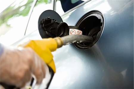 fill - Refueling vehicle at gas station Stock Photo - Premium Royalty-Free, Code: 695-05771074