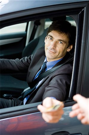 drive-thru - Customer in drive-thru handing credit card to check-out window clerk Stock Photo - Premium Royalty-Free, Code: 695-05771071