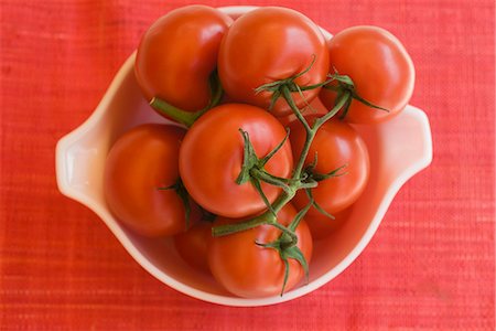 stem (botanical) - Ripe vine tomatoes in bowl Stock Photo - Premium Royalty-Free, Code: 695-05771487