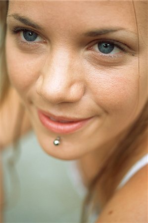 Young woman with facial piercing, close-up Stock Photo - Premium Royalty-Free, Code: 695-05772248