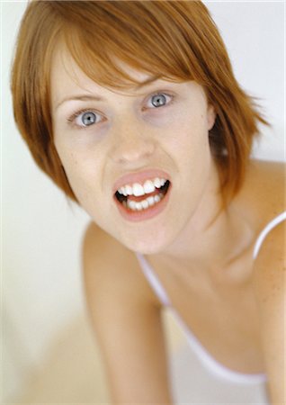 simsearch:400-06363059,k - Young woman with mouth open Stock Photo - Premium Royalty-Free, Code: 695-05772708