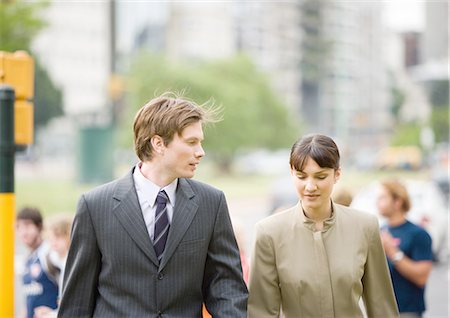 Young businessman walking with female collegue Stock Photo - Premium Royalty-Free, Code: 695-05772747