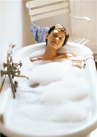 simsearch:633-06354677,k - Woman taking bubble bath, front view, full length Stock Photo - Premium Royalty-Free, Code: 695-05773037