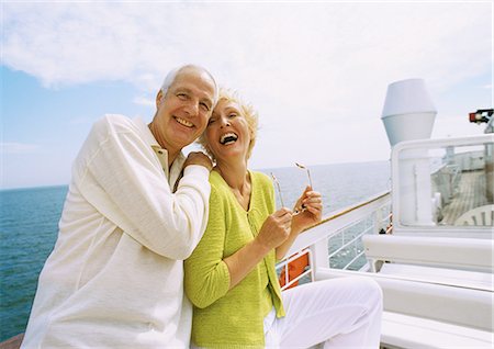Mature couple posing on boat deck, laughing Stock Photo - Premium Royalty-Free, Code: 695-05773423