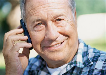 phone one person adult smile elderly - Mature man with a cell phone, close-up, portrait Stock Photo - Premium Royalty-Free, Code: 695-05773695