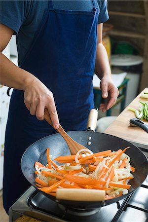 saute - Stir-frying vegetables Stock Photo - Premium Royalty-Free, Code: 695-05780145