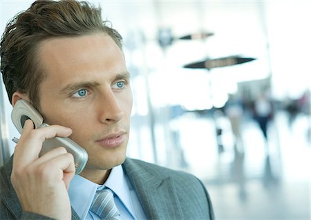 simsearch:695-03376228,k - Businessman using cell phone in airport Stock Photo - Premium Royalty-Free, Code: 695-03374226