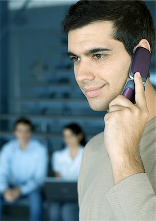 simsearch:695-03376228,k - Man using cell phone, smiling Stock Photo - Premium Royalty-Free, Code: 695-03374287