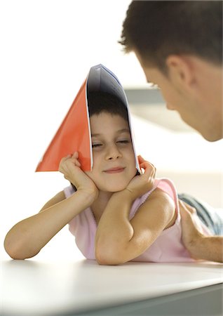 simsearch:695-05768235,k - Girl holding notebook over head, turning toward father Stock Photo - Premium Royalty-Free, Code: 695-03374367