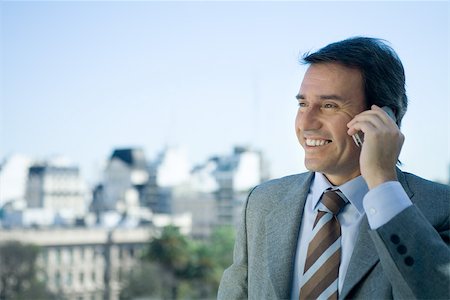 simsearch:695-03376228,k - Businessman using cell phone, skyline in background Stock Photo - Premium Royalty-Free, Code: 695-03374833