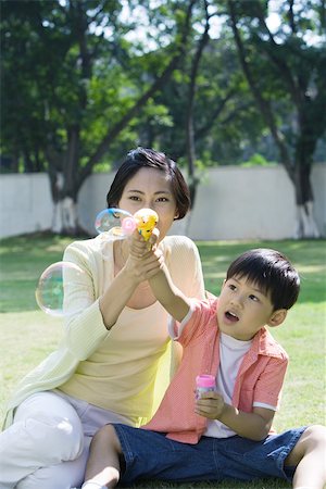 simsearch:632-05604245,k - Mother and son making bubbles Stock Photo - Premium Royalty-Free, Code: 695-03374893