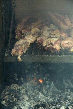 Meat grilling in barbecue Stock Photo - Premium Royalty-Free, Code: 695-03375520