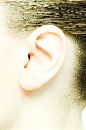 Teenage girl's ear, extreme close-up Stock Photo - Premium Royalty-Free, Code: 695-03375586