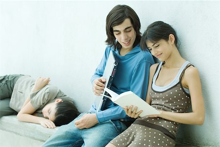 simsearch:633-01715612,k - Young friends reading book together Stock Photo - Premium Royalty-Free, Code: 695-03375702