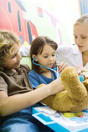 simsearch:695-05768235,k - Boy and girl playing doctor with teddy bear Stock Photo - Premium Royalty-Free, Code: 695-03375875
