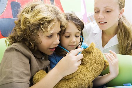 simsearch:695-05768235,k - Boy and girl playing doctor with teddy bear Stock Photo - Premium Royalty-Free, Code: 695-03375876
