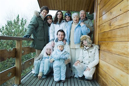 simsearch:696-03401677,k - Mixed age group standing on deck in winter clothes, group portrait, full length Stock Photo - Premium Royalty-Free, Code: 695-03376154