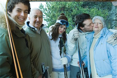 simsearch:696-03401677,k - Group of skiers, young man kissing senior woman on check, portrait Stock Photo - Premium Royalty-Free, Code: 695-03376151
