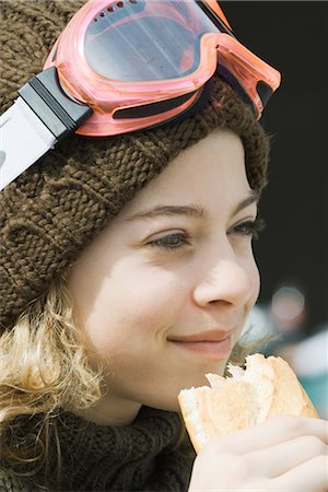 simsearch:695-03376367,k - Girl wearing ski gear, eating sandwich, close-up Stock Photo - Premium Royalty-Free, Code: 695-03376389