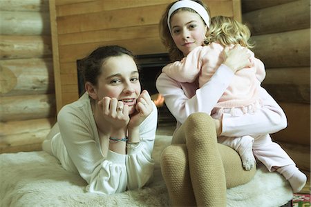 simsearch:695-03388794,k - Two teen girls with little sister, smiling at camera Stock Photo - Premium Royalty-Free, Code: 695-03376584