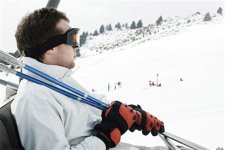 simsearch:695-03376478,k - Young man taking ski lift Foto de stock - Sin royalties Premium, Código: 695-03377063