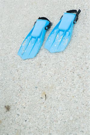 flippers - Plastic flippers on sand, close-up Stock Photo - Premium Royalty-Free, Code: 695-03377237