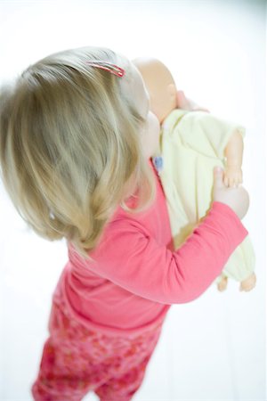 simsearch:695-05768235,k - Blonde toddler girl holding baby doll Stock Photo - Premium Royalty-Free, Code: 695-03377399