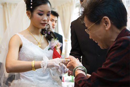 Chinese wedding, giving of jewelry to the bride Stock Photo - Premium Royalty-Free, Code: 695-03377438