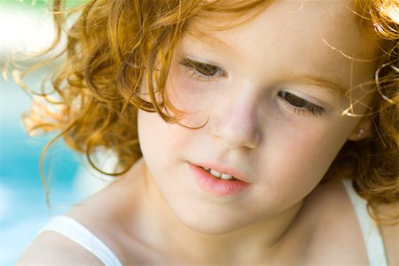simsearch:614-06043612,k - Little girl with red hair looking down, portrait Stock Photo - Premium Royalty-Free, Code: 695-03378635