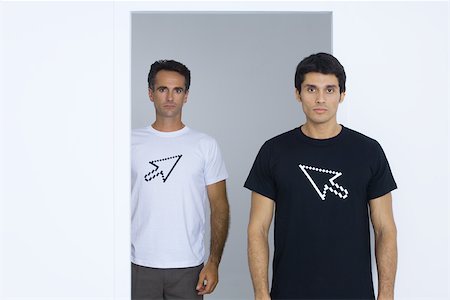 Two men wearing tee-shirts printed with computer cursors Stock Photo - Premium Royalty-Free, Code: 695-03378792