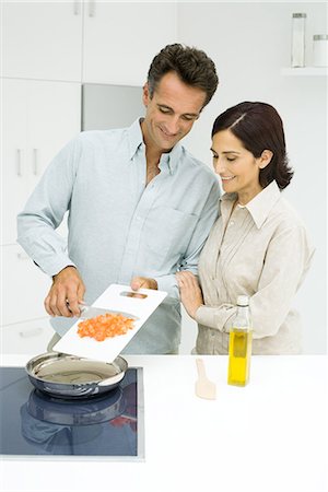 simsearch:696-03395895,k - Woman and man cooking in kitchen Stock Photo - Premium Royalty-Free, Code: 695-03378919