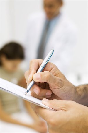 form patient - Man's hands writing on tablet, close-up, cropped view Stock Photo - Premium Royalty-Free, Code: 695-03379564