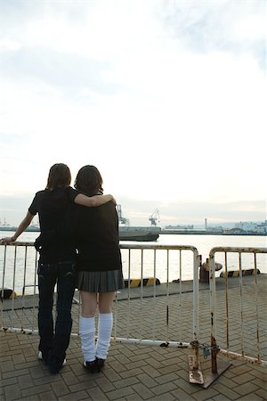 simsearch:695-03386286,k - Young couple standing together, looking at waterfront, rear view Stock Photo - Premium Royalty-Free, Code: 695-03379794