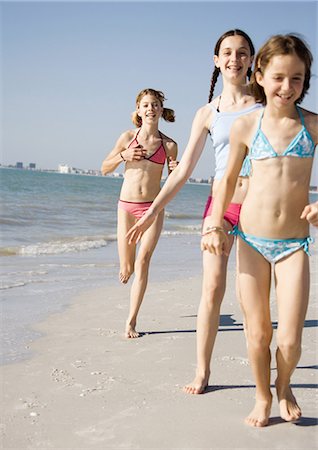 simsearch:633-01714467,k - Girls running and walking on beach Stock Photo - Premium Royalty-Free, Code: 695-03373441