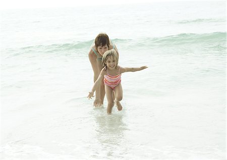 Mother and daughter in water at beach Stock Photo - Premium Royalty-Free, Code: 695-03373518