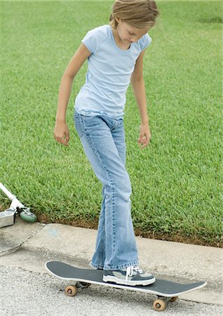 Girl on skateboard Stock Photo - Premium Royalty-Free, Code: 695-03373954